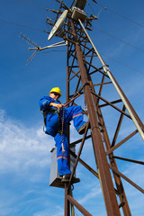 Electrician repairs the radio link on lamppost