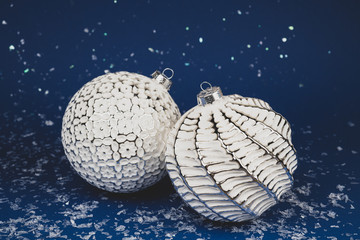 Christmas white balls on a blue background.