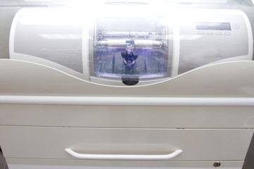 CAD CAM dental computer for prosthesis and crowns milling. Machine making ceramic tooth