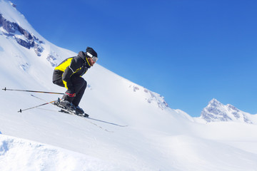 Naklejka na ściany i meble Jumping skier at mountains