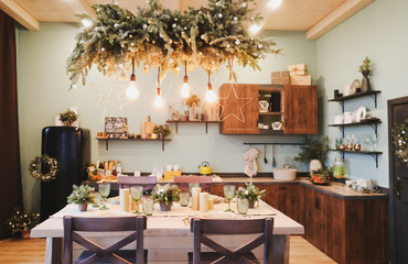 Festive interior in Christmas decorations. modern living room or dining room. Beautiful New Year decorated classic home interior. 
