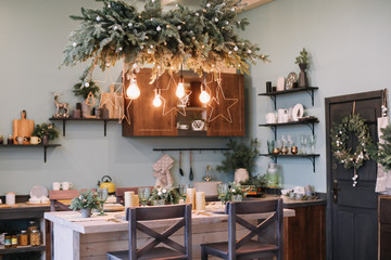 Festive interior in Christmas decorations. modern living room or dining room. Beautiful New Year decorated classic home interior. 
