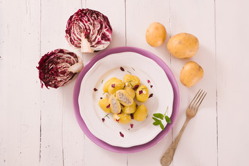 Potato gnocchi stuffed with radicchio and ricotta.