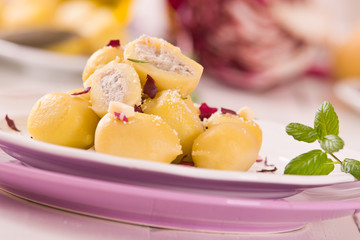 Potato gnocchi stuffed with radicchio and ricotta.