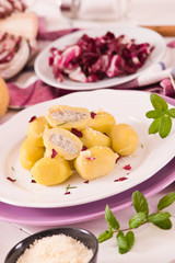 Potato gnocchi stuffed with radicchio and ricotta.