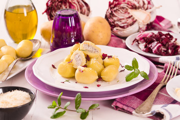 Potato gnocchi stuffed with radicchio and ricotta.