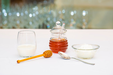 fresh milk and yoghurt with a jar of honey