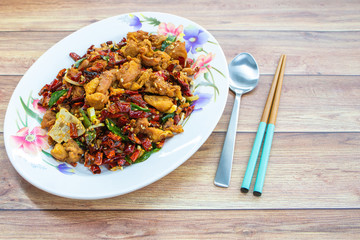 Authentic Sichuan Szechuan fried chicken with spicy red hot chillies & peppercorns. Asia China Chinese food cuisine. Chengdu Chongqing culinary.