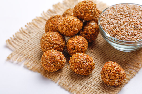 Til Gul OR Sweet Sesame Laddu for Indian festival Makar Sankranti over white background 