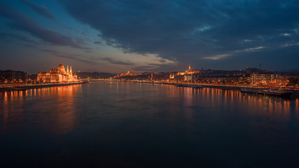Incredible Evening View of Budapest parliament and Danube river at sunset, Hungary. Wonderful Cityscape with Colorful sky.