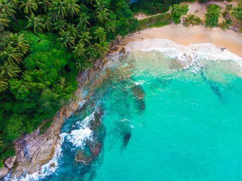 White sand beach turquoise sea wave aerial view copy space