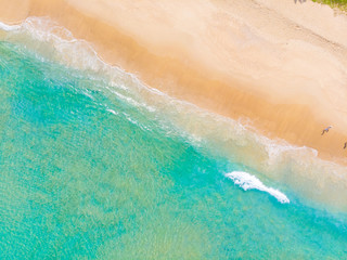 White sand beach turquoise sea wave aerial view copy space