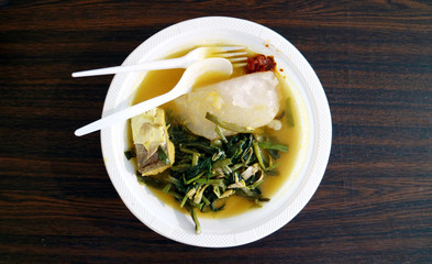 Papeda, sauteed kale and fish. Papuan food (Indonesian).