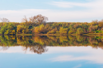 Fototapeta na wymiar Autumn forest river reflection landscape