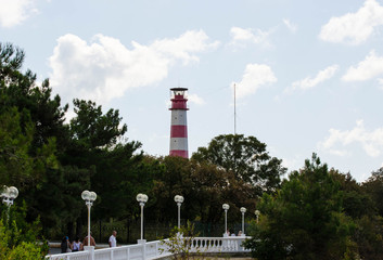 lighthouse on background of blue sky