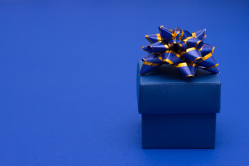 Celebration classic blue card with gift box , background with copy space