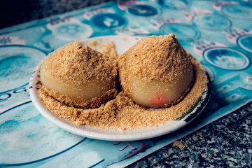 Japanese mochi with nut on the blue table