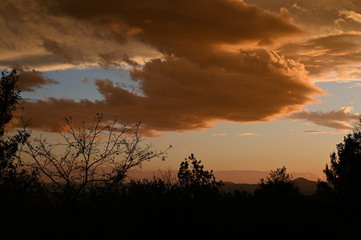 Orange clouds during winter time in Italy