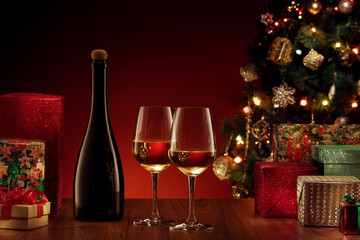 close up view of champagne with gifts on  color back
