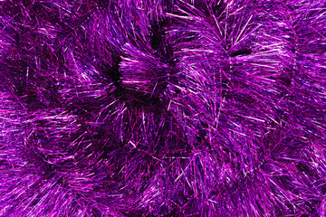 Background of purple christmas tinsel