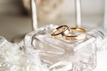 two beautiful golden wedding rings. A wonderful composition of rings and other wedding attributes - 308719115