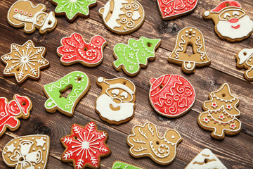 Christmas gingerbread cookies on brown wooden table