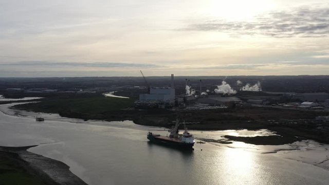 Wide aerial orbit view of Kemsley Industry in Kent, UK at sunset