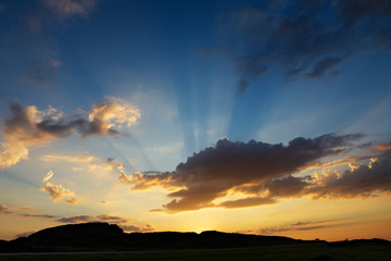 Sunset with sun rays, summer night in Northern Norway