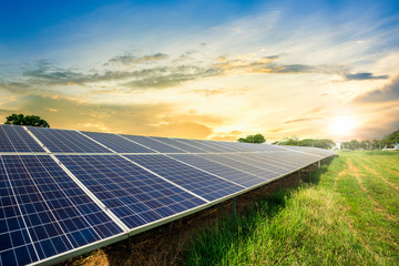 Solar panel cell on dramatic sunset sky background,clean Alternative power energy concept. - obrazy, fototapety, plakaty