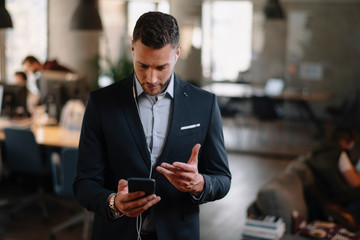 Handsome businessman having video call in office.