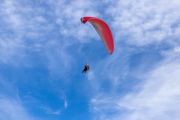 paragliding in the blue sky