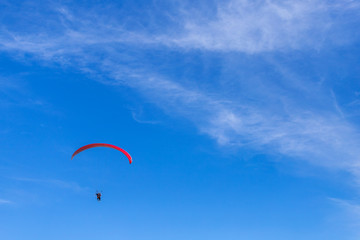 paragliding in the blue sky