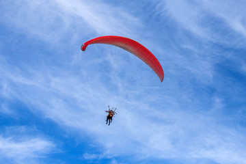 paragliding in the blue sky