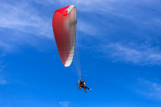 paragliding in the blue sky