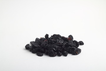 black raisins isolated on a white background