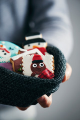 man with christmas cookies in his hands