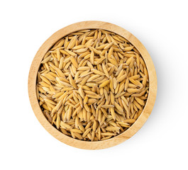 paddy rice seed in woo bowl on white background. top view