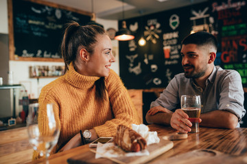 couple eating junk food in food corner