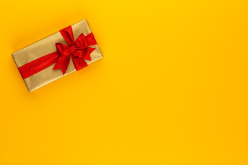 Christmas, holiday present box on red background.