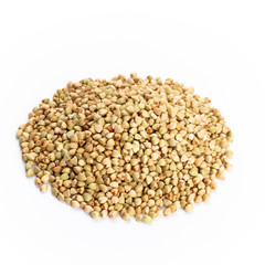 Heap of dried buckwheat seeds isolated on white background.