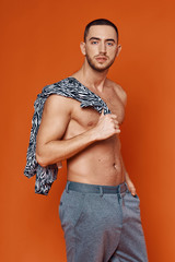 Fototapeta premium young man in jeans and white shirt