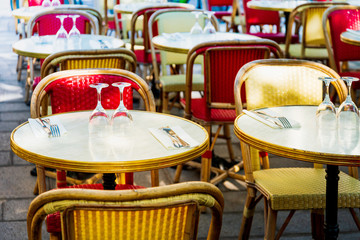 Street view of a coffee terrace with tables and chairs in europe
