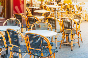 Street view of a coffee terrace with tables and chairs, Paris, France