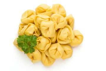 Raw homemade pasta,tortellini with herbs.