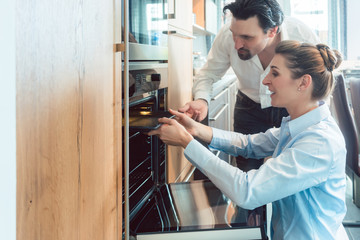 Woman and man deciding on buying a new kitchen