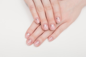 woman hands and nails pink french