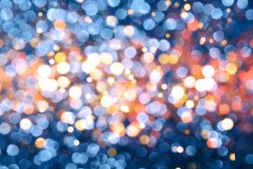 Blue festive background with sparkles in the bokeh. The concept of the celebration, the day of Christmas, New Year, birthday, ceremonies, events, etc.