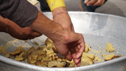 man's making food in big bowl at outdoor