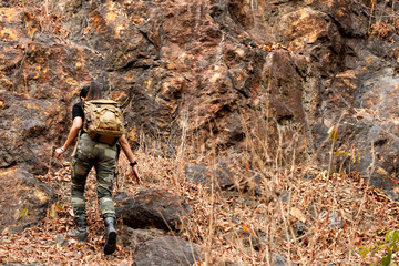 Asian Women hiker or traveler with backpack adventure climb up  and explore on mountain nature outdoor weekend.  Relax and Travel destination leisure in holiday.  Travel and Trip Concept.