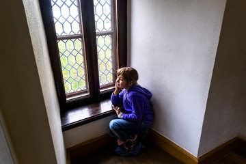 little girl sitting by the window, sovtfocus